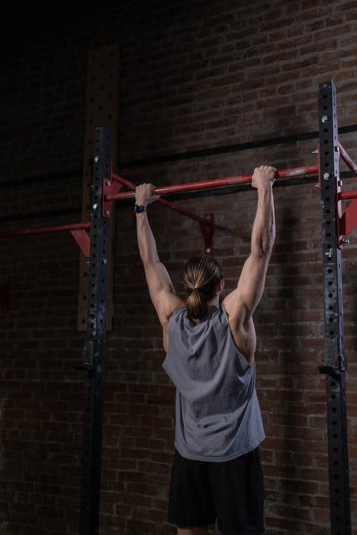 A person able to do pull-ups after training in calisthenics