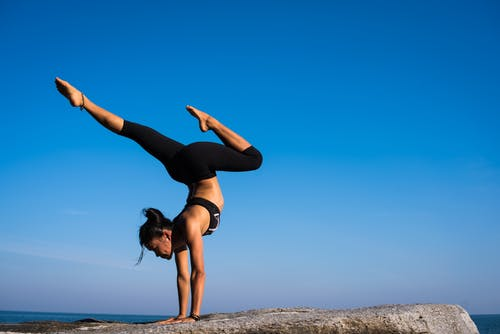 woman doing a handstand